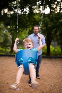 Boy in swing by Michael Beard Photography